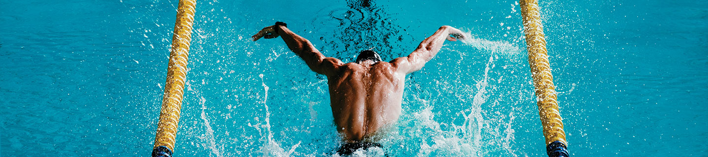 a man swimming the butterfly stroke